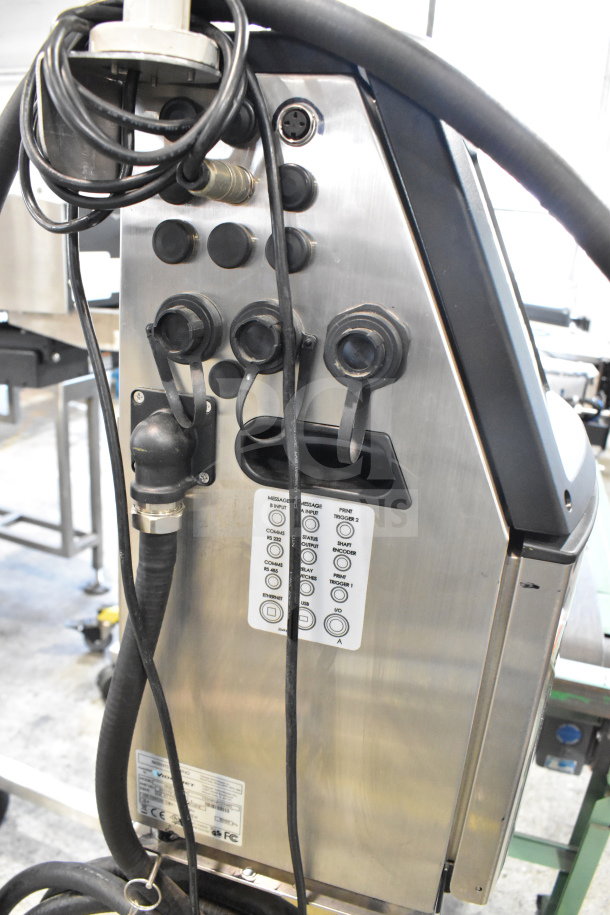 Videojet 1620 Floor Style Inkjet Printer, stainless steel body, visible input/output ports, labels indicating connections.