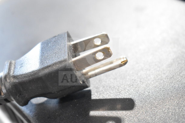 Close-up of a power plug for a Videojet 1620 Inkjet Printer, showing standard three-prong design.