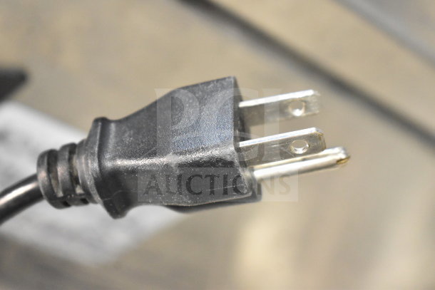 Plug of Videojet 1620 Inkjet Printer, compatible with 100-120/200-240 Volts, 1 Phase, shown in focus.