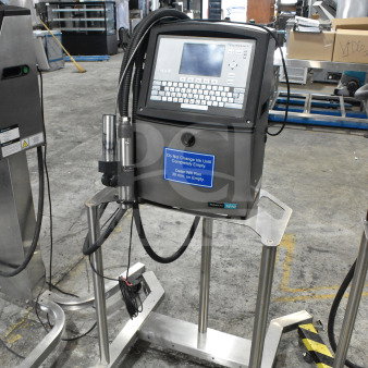 Videojet 1610 inkjet coding machine on stand, 100-240V, 1 phase; features display screen, control panel, caution label.
