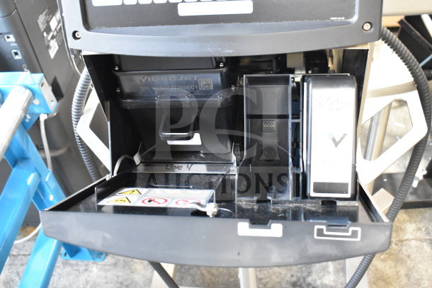 Videojet 1610 Inkjet Coding Machine, floor model, showing open interior. Displays model label and safety icons.
