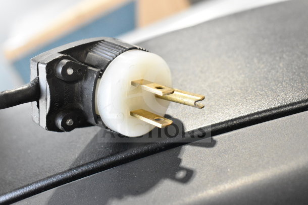 Plug of Videojet 1610 Inkjet Coding Machine, showing three-pronged connector for 100-120/200-240 volts, 1-phase power.