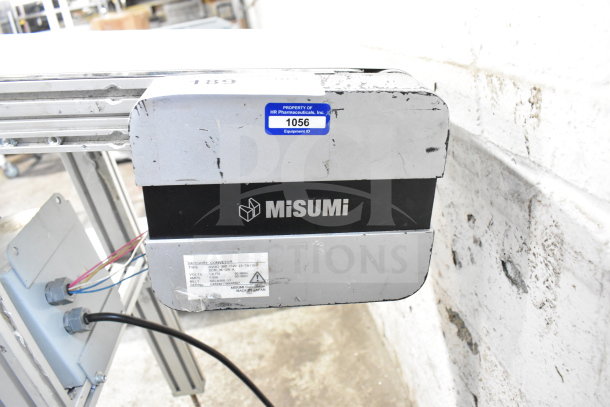 MiSumiFloor Style Conveyor, 115 Volts, 1 Phase, showing MiSumi branding and equipment ID tag 1056 on metal casing.