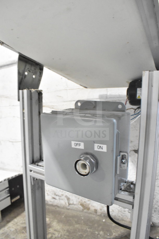 MiSumi floor style conveyor, 115 volts, 1 phase, shown with off/on switch, metal frame, used condition.