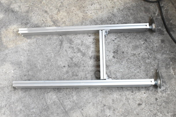 MiSumiFloor Style Conveyor, aluminum frame, 115 volts, 1 phase, in good condition, visible support legs.