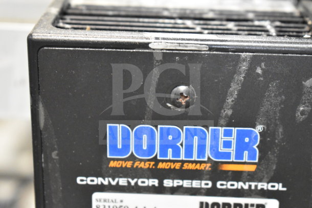 2020 Dorner 22MV1122B conveyor speed control, showing brand logo and serial number tag. Black casing, minor surface wear.