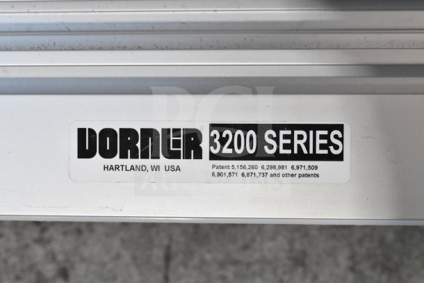 Dorner 32MTEM12 3200 Series Conveyor, silver frame, USA-made, patent info visible, sturdy industrial design.