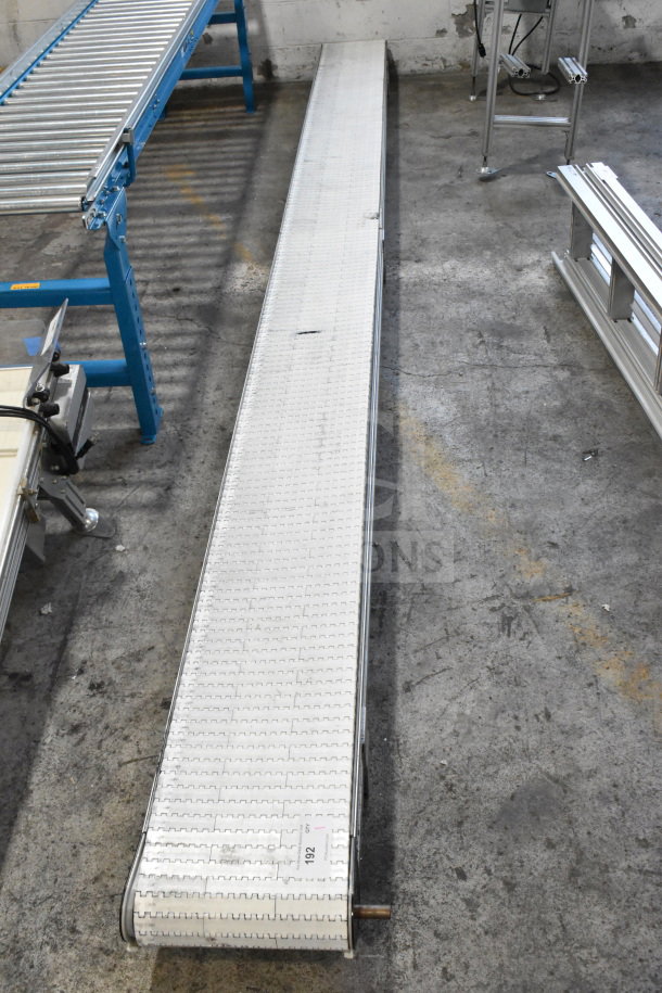 Dorner 32MTEM12 Conveyor, white segmented belt, sturdy frame, in good condition, shows minimal wear, ID tag labeled "192."