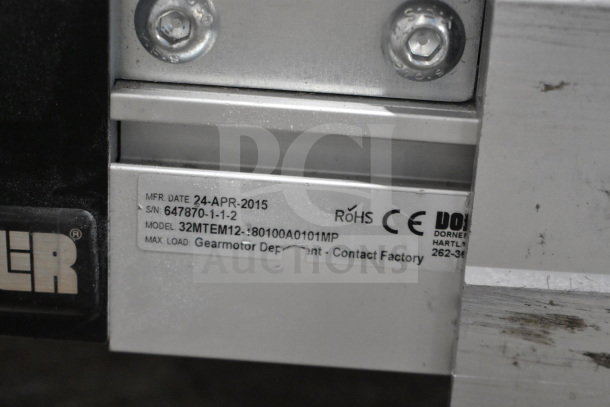 Dorner 32MTEM12 Conveyor label showing model, serial number, manufacture date April 24, 2015, RoHS and CE markings.