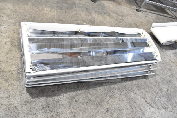 Howard M032817 light fixture stack, reflective aluminum panels, used condition, four-pack, ideal for large spaces.