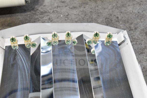 Howard M032817 light fixture, reflective panels, 4 bulb sockets. Auction: 4 times your bid. Mint condition.