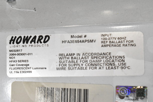 Howard M032817 light fixture label showing model HFA3E654APSMV, suitable for damp locations, 120-277V input.