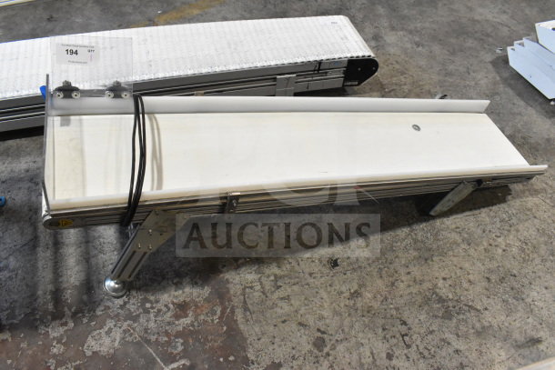 MiSumi CVGC-300 conveyor belt, 115V, 1 phase, in used condition. Includes metal frame and visible cables, ideal for industrial use.