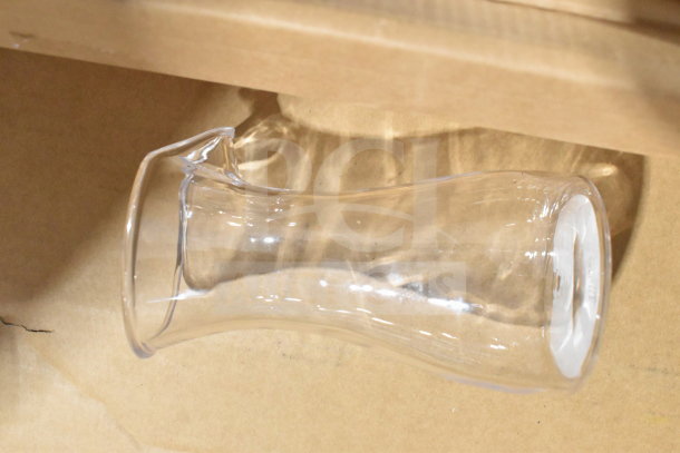Transparent Crathco hopper in clear plastic, slightly curved shape. Part of 30 various items auction lot.