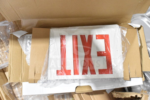 Cardboard box containing exit sign in protective plastic, part of varied auction lot including Crathco hoppers and more.