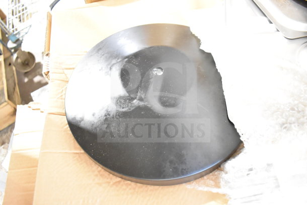 Black disc lid from Crathco hoppers on cardboard. Light wear visible. Part of 30-item auction including various kitchenware.