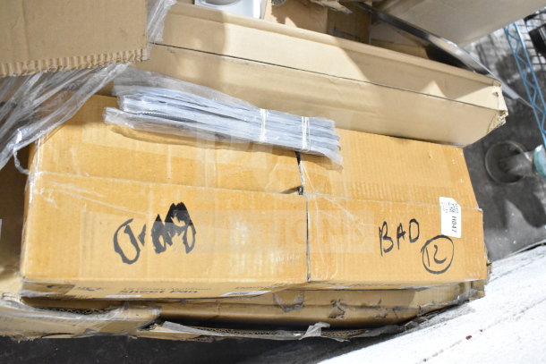 Boxes of assorted items including Crathco hoppers, coffee filters, and sheet pans. Marked "BAD" and numbered tags visible.
