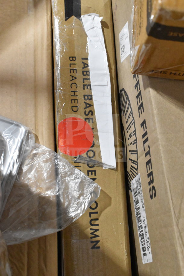 Various items including Crathco hoppers, coffee filters, and more in boxes. Visible labels for table bases and coffee filters.