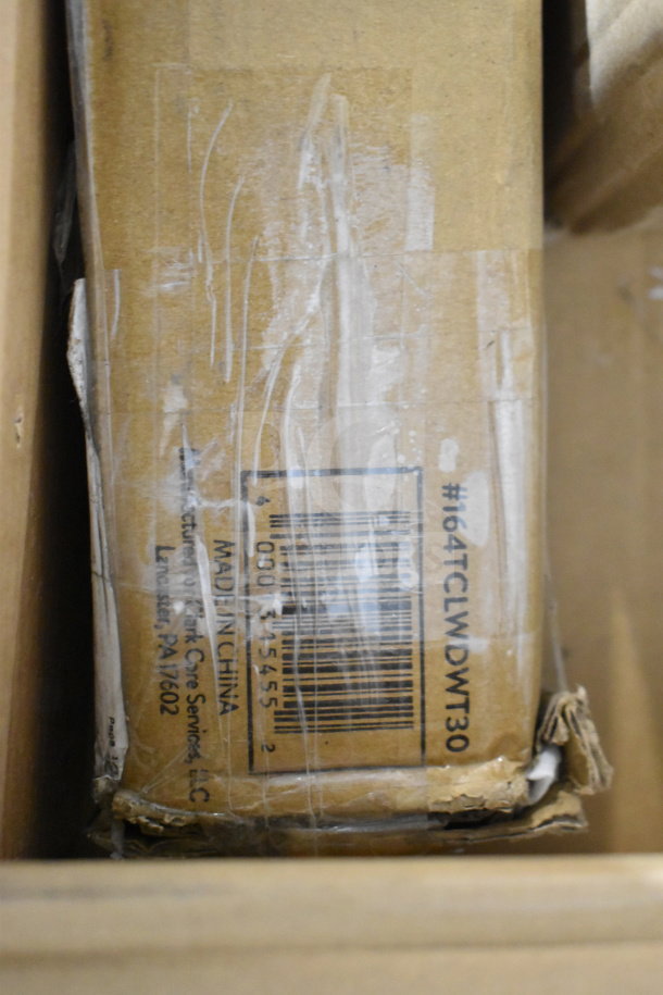Cardboard box with label indicating "Made in China" and barcode. Contains mixed items like Crathco hoppers and Choice dinner knives.