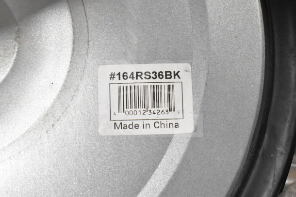 Auction item label on a metal surface, reads "#164RS36BK, Made in China," indicative of product identification.