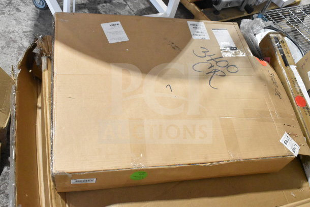 Cardboard box with assorted restaurant supplies, including Crathco hoppers, coffee filters, and Choice sheet pans. Marked "3400 CR.”
