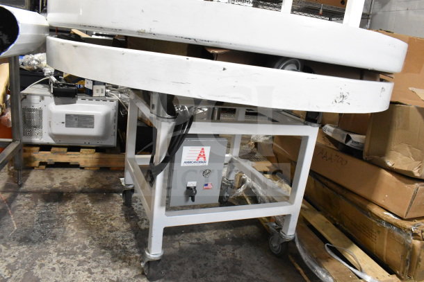 2 American Design ADP-48-PC rotary table on commercial casters, 115 volts, 1 phase. White finish, visible control panel.