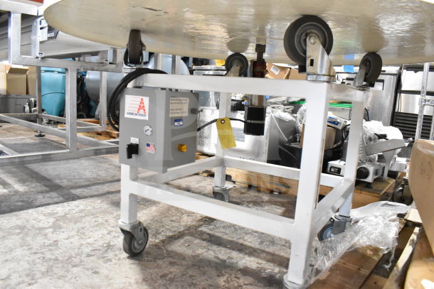 2 American Design ADP-48-PC rotary tables on commercial casters, 115 volts, 1 phase, metal frame, visible control panel.