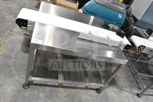 Dorner 32MTEM12 floor style conveyor with table. Stainless steel, 115 volts, 1 phase. Visible label: "199." Excellent condition.
