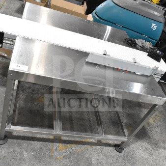 Dorner 32MTEM12 floor style conveyor with table. Stainless steel, 115 volts, 1 phase. Visible label: "199." Excellent condition.