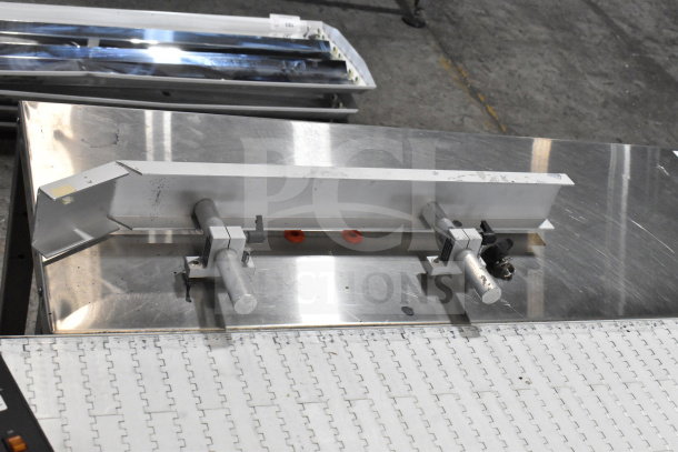 Dorner 32MTEM12 floor-style conveyor with table, 115 volts, 1 phase, features durable stainless steel surface and adjustable components.