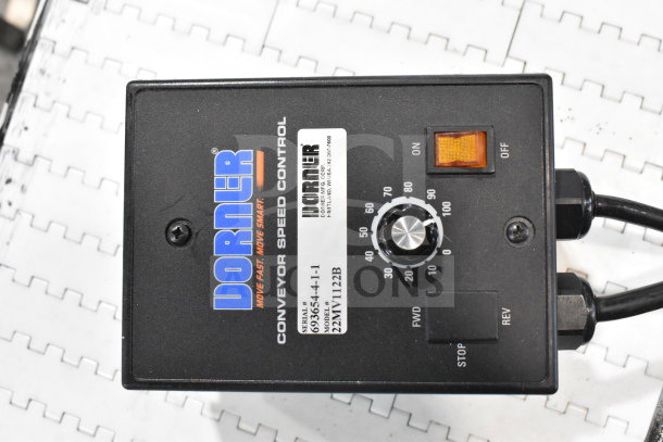 Dorner 32MTEM12 conveyor control box, features speed dial, power switch, labels showing serial and model numbers.