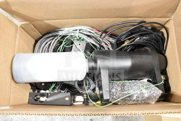 Two boxes containing a wash station kit, 25-way I/O breakout cable, and fiber optic light guide. Auction items in good condition.