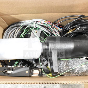 Two boxes containing a wash station kit, 25-way I/O breakout cable, and fiber optic light guide. Auction items in good condition.