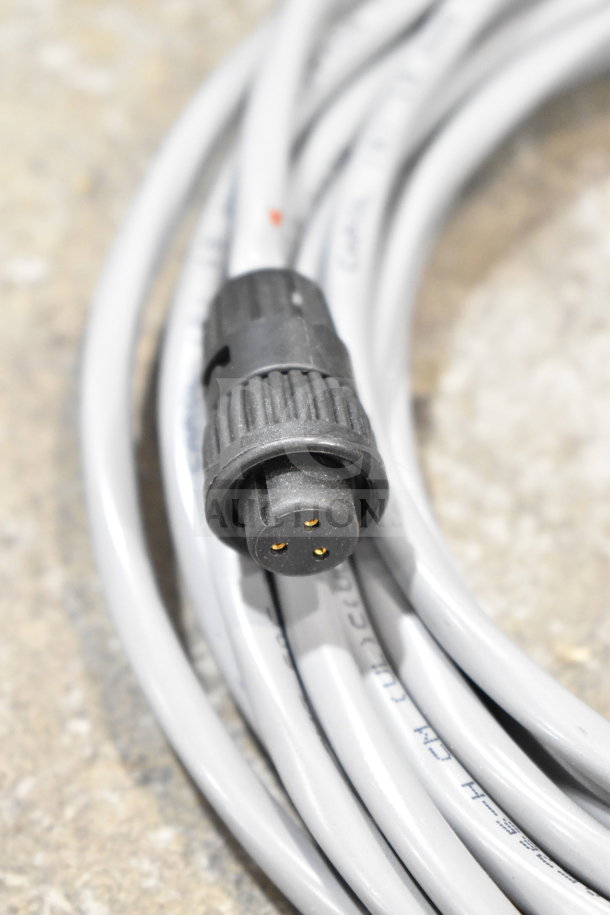 Coiled 25 Way I/O breakout cable with black connector, part of a lot including wash station kit and fiber optic light guide.