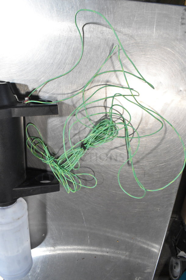 2 boxes containing wash station kit, 25-way I/O breakout cable, fiber optic light guide; wires shown bundled on a metal surface.