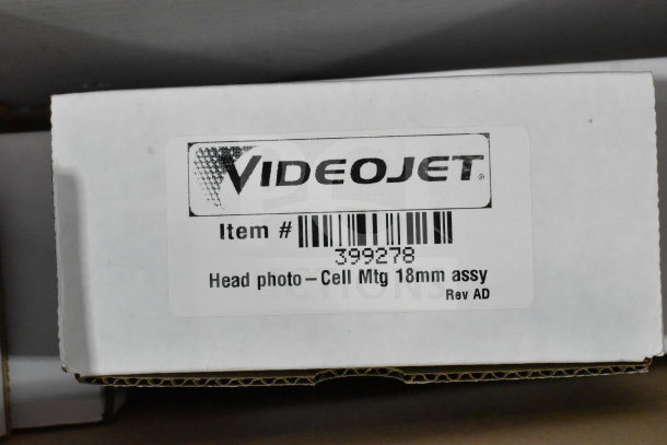 Two boxes of various items including wash station kit, 25-way I/O breakout cable, fiber optic light guide. Videojet label shown.