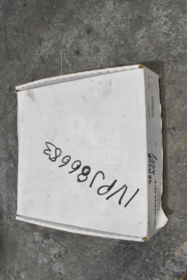 Two boxes including a wash station kit, 25-way I/O breakout cable, fiber optic light guide. White box labeled "Sensor Assy".