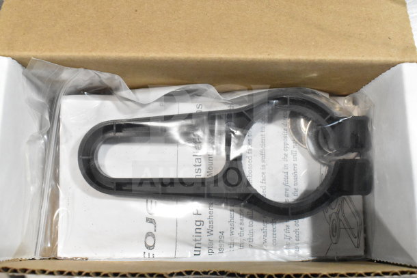 Cardboard box containing various items, including a wash station kit with installation instructions and plastic components.