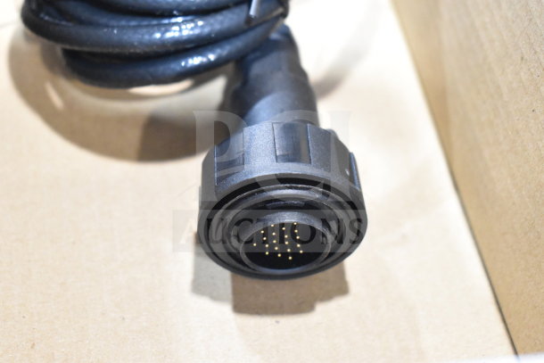 2 boxes with various items including wash station kit, 25-way I/O breakout cable, fiber optic light guide. Bid doubles contents.