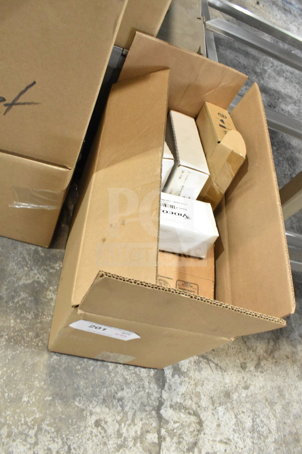 Cardboard box with 12 VideoJet items, including a head photo, label sensor, and septum assembly. Auction lot 201.