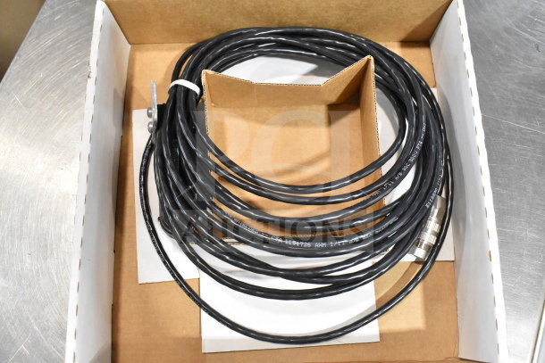 Box with coiled black cable, part of 12-item lot including VideoJet components. Cable features CSA markings.