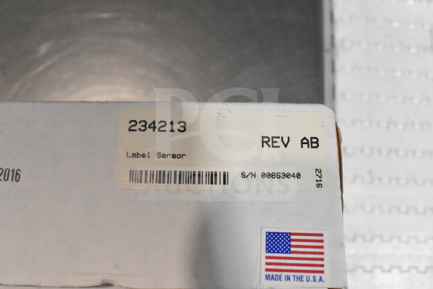 VideoJet Label Sensor with serial number 00863040, REV AB. Includes USA-made label. Part of a 12-item auction lot.