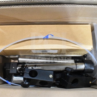 Two boxes containing various items including cables, mounting plates, VideoJet nozzle bypass manifold kit, and more.