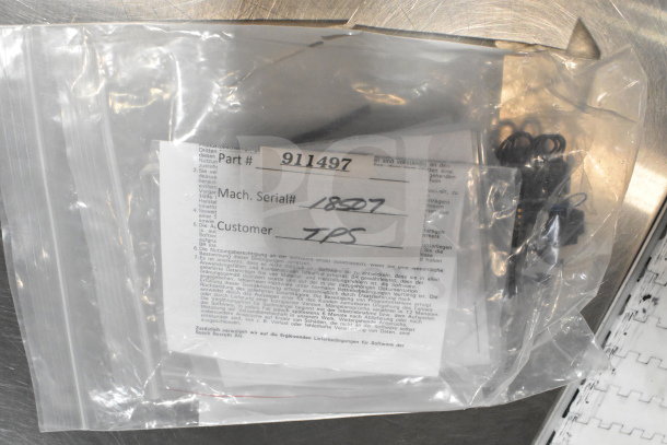 Clear plastic bag with a VideoJet nozzle bypass manifold kit, part number 911497, machine serial 18507, customer TPS.