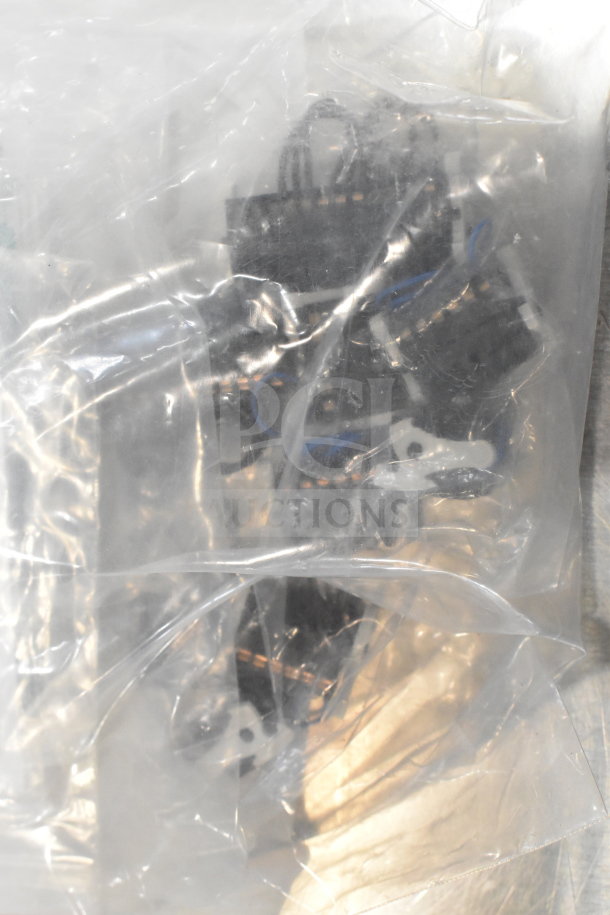 Two boxes containing cables, mounting plates, and a VideoJet nozzle bypass manifold kit, labeled for auction.