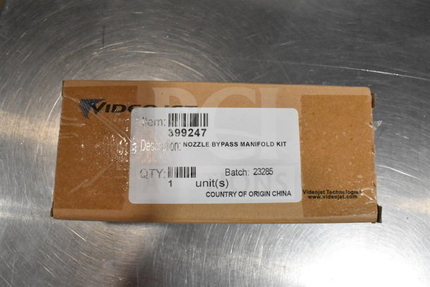 Cardboard box labeled "VideoJet Nozzle Bypass Manifold Kit," item 399247, batch 23285, made in China.