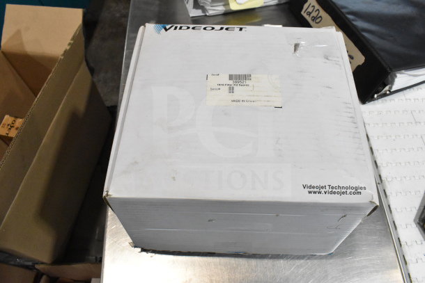 2 boxes containing cables, mounting plates, and VideoJet Nozzle Bypass Manifold Kit. Box labeled "VideoJet Technologies," with condition visible.