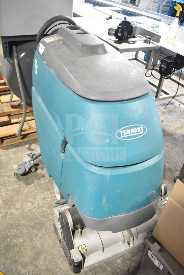 Tennant T5 Floor Cleaning Machine, blue, visible scuffs, model label present, suitable for commercial cleaning tasks.