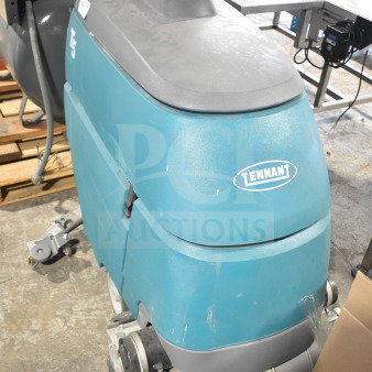 Tennant T5 Floor Cleaning Machine, blue, visible scuffs, model label present, suitable for commercial cleaning tasks.