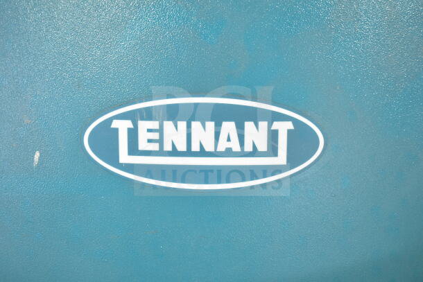 Tennant T5 Floor Cleaning Machine, blue, visible Tennant logo, industrial-grade, robust design.